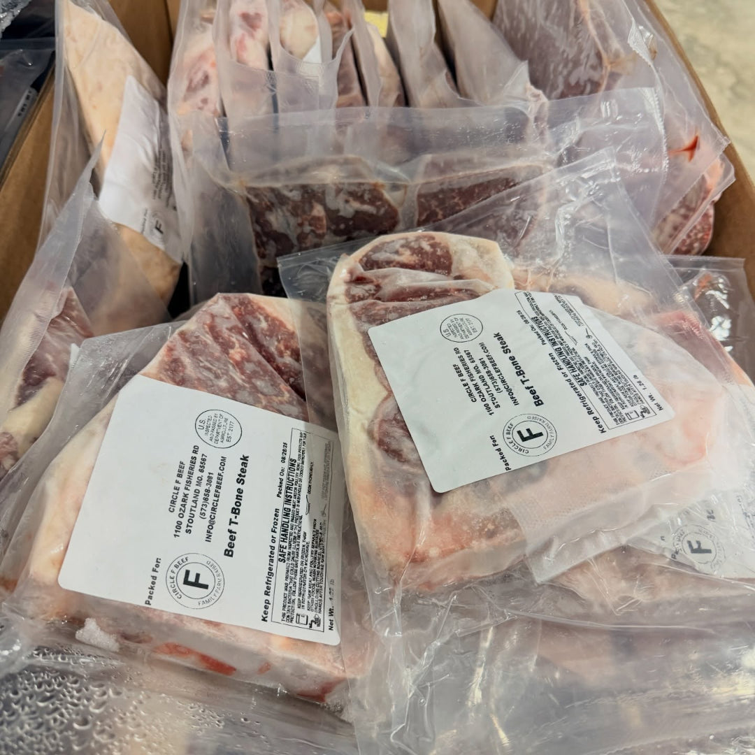 Packaged beef steaks with labels in clear plastic bags.